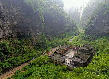 High angle view of built structures amidst mountains