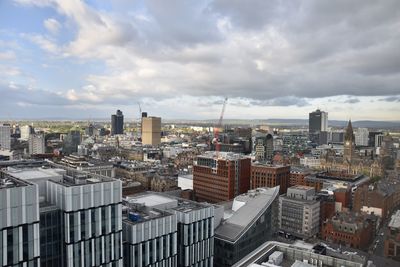 High angle view of buildings in city against sky
