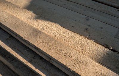 High angle view of shadow on wood