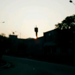 Silhouette man against sky during sunset