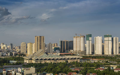 Modern buildings in city against sky