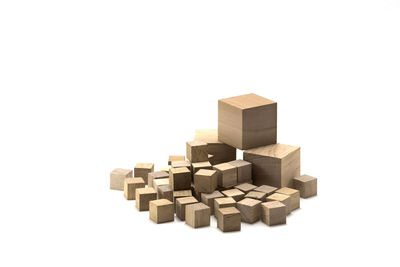 Stack of wooden structure against white background
