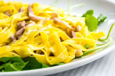 Close-up of tagliatelle pasta carbonara 