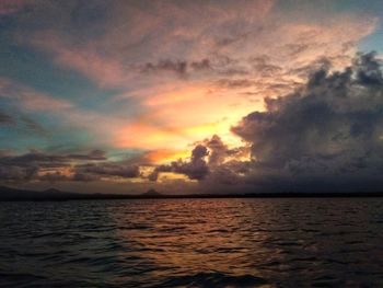 Scenic view of sea against dramatic sky