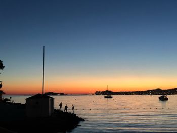 Scenic view of sea against clear sky during sunset