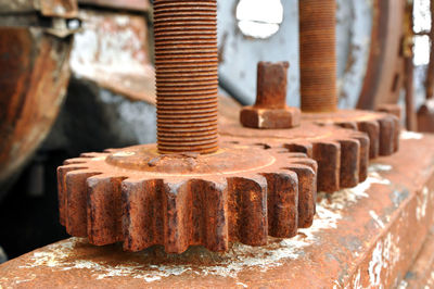 Rusty spur wheel, industrial background