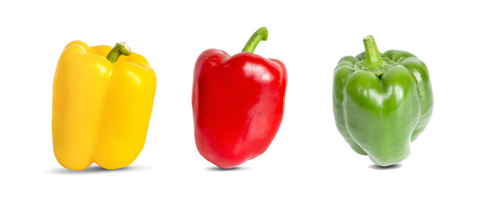 Close-up of bell peppers against white background