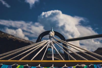 Low angle view of ferris wheel against sky