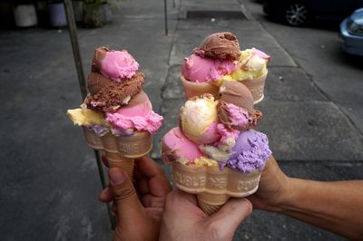 Cropped hand holding ice cream cone