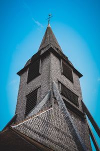 Low angle view of temple against clear blue sky