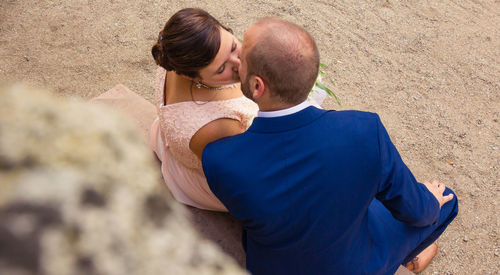 Rear view of couple standing outdoors