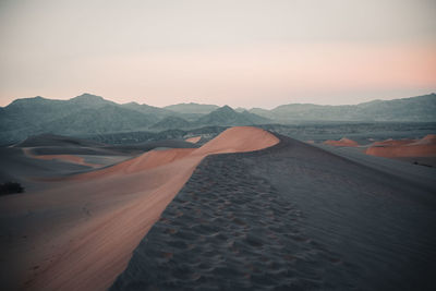 Scenic landscape shot of sand dune ridge during sunset in death valley
