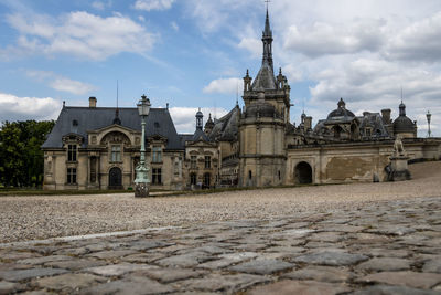 View of historic building against cloudy sky