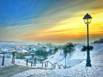 Scenic view of snow covered landscape at dusk