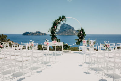 Scenic view of swimming pool by sea against clear sky