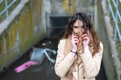 Portrait of woman standing outdoors