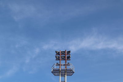 Low angle view of floodlight against sky
