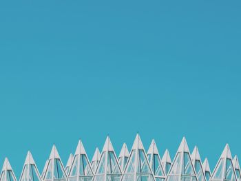 Low angle view of built structure against clear blue sky