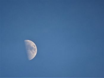 Close-up of moon against blue sky