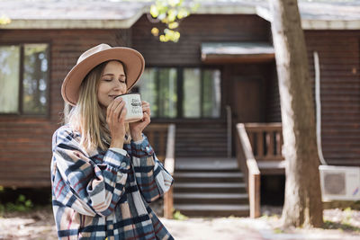 Young stylish caucasian woman 30-35 years old wearing casual clothing shirt and cowboy hat 