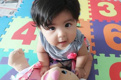 Portrait of boy playing with toy