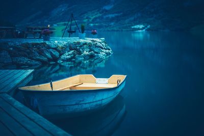 Boat moored in lake