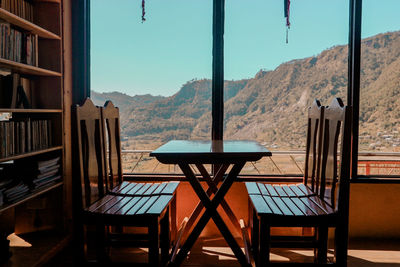 Empty chairs and tables in restaurant