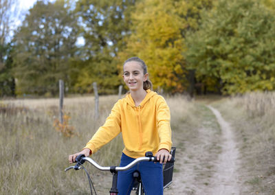 Portrait of smiling girl riding bicycle