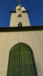 Low angle view of church against blue sky