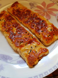 High angle view of pizza in plate on table