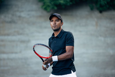 Young man playing tennis