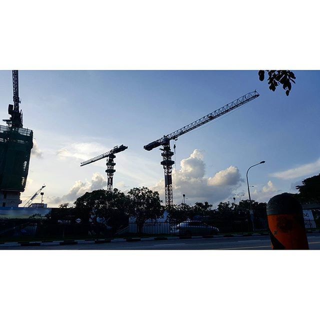 transfer print, building exterior, built structure, architecture, car, transportation, land vehicle, auto post production filter, city, sky, street, mode of transport, clear sky, street light, power line, road, electricity pylon, city street, outdoors, city life