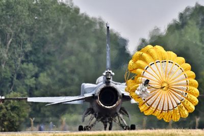 Parachute against air vehicle on field