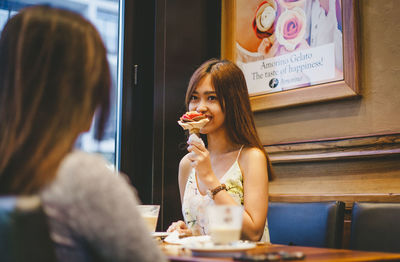 Portrait of woman sitting in restaurant