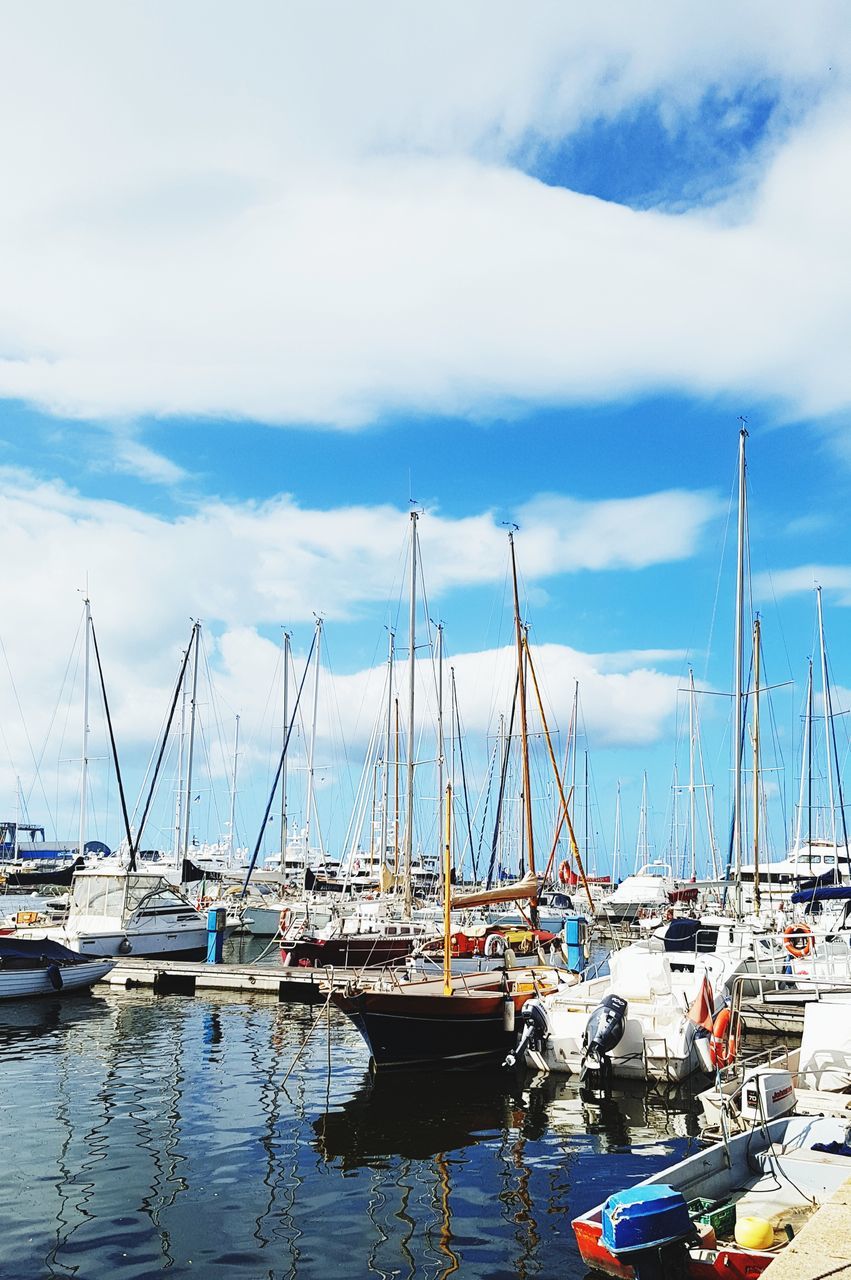 transportation, nautical vessel, mode of transportation, water, cloud - sky, sailboat, moored, pole, sky, harbor, mast, day, no people, nature, sea, waterfront, outdoors, travel, reflection, yacht, marina, port