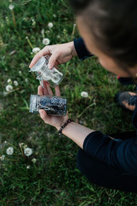 Woman holding glasses with nature objects