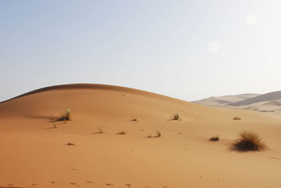 Scenic view of desert against clear sky