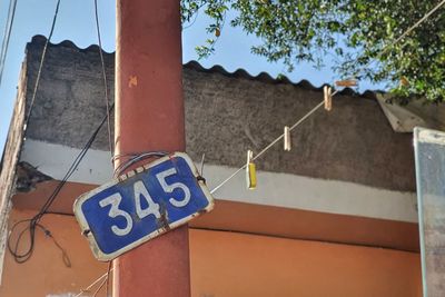 Low angle view of sign on wall