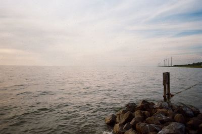 Scenic view of sea against sky at sunset