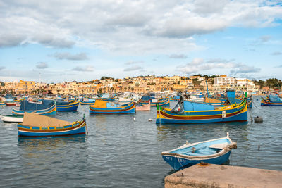 Boats moored at dock