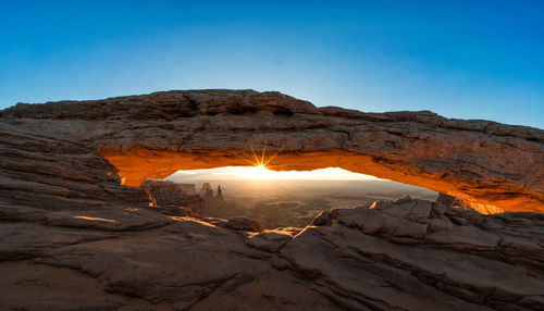 Scenic view of natural arch against clear sky