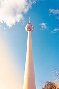 Low angle view of communications tower against sky