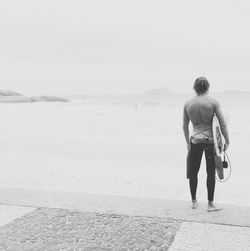 Full length of woman standing on beach