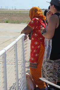 Close-up of woman standing on wall