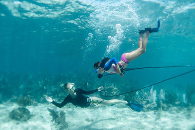 Woman swimming in sea