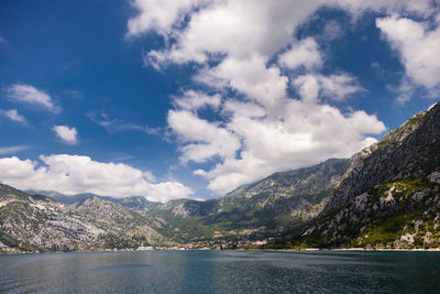 Scenic view of lake against cloudy sky