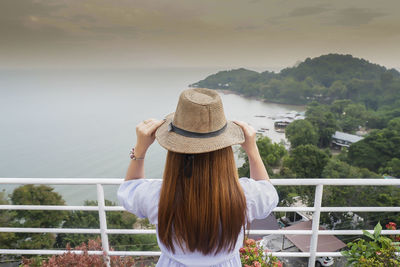 Rear view of woman looking at waterfall