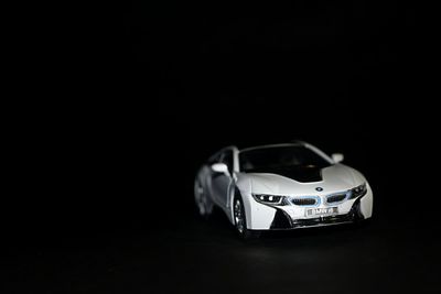 Close-up of toy car against black background