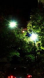 Low angle view of illuminated street light at night