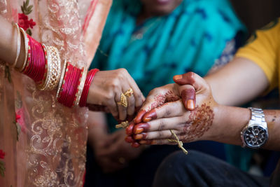 Midsection of woman holding hands